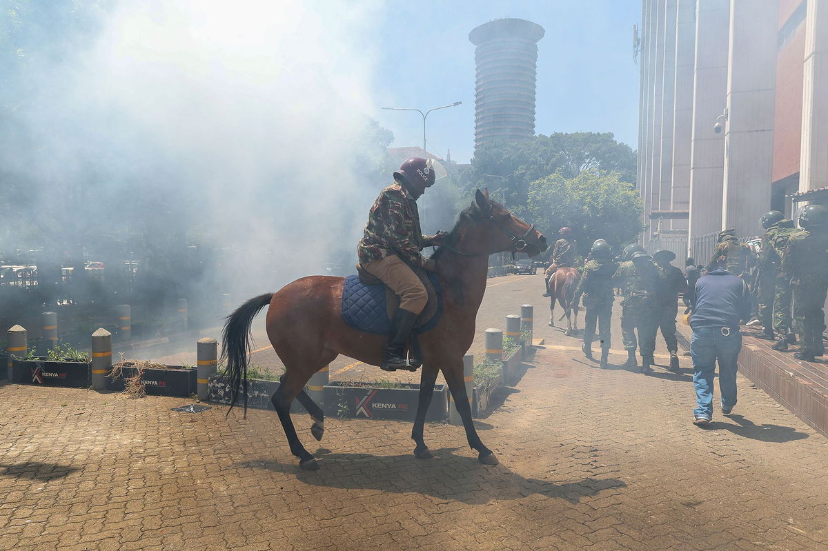 <i>Daniel Irungu/EPA-EFE/Shutterstock via CNN Newsource</i><br/>A mounted anti-riot police officer tries to escape the teargas used to disperse activists during a protest against the rise in alleged abductions of government critics in Nairobi