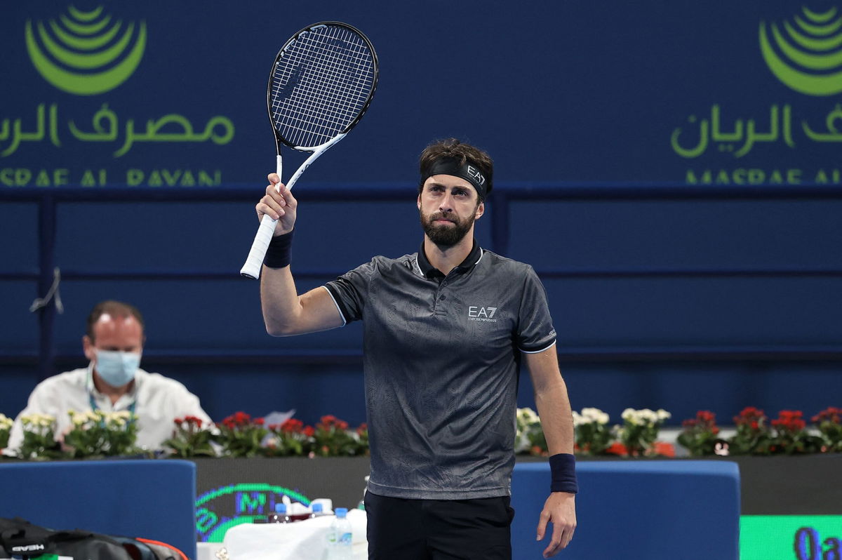 <i>Karim Jaafar/AFP via Getty Images via CNN Newsource</i><br/>Nikoloz Basilashvili reacts after winning the semifinal of the 2022 ATP Qatar Open on February 18