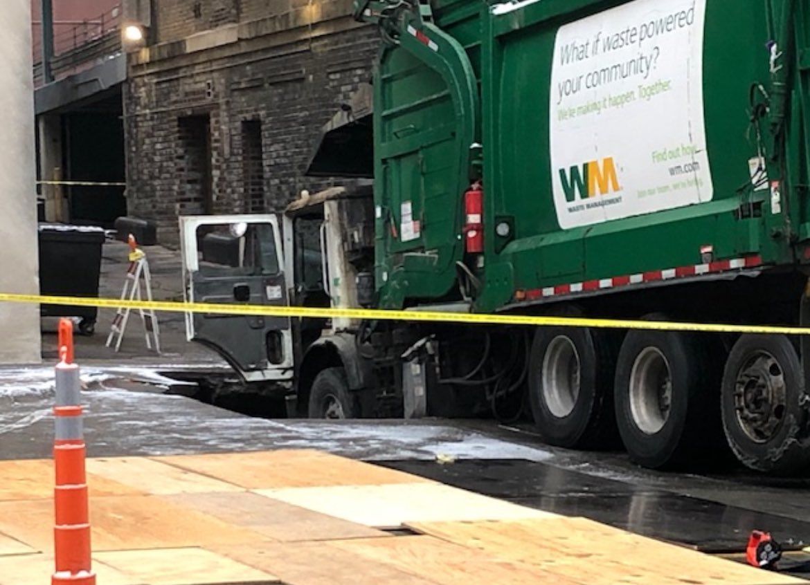 <i>KETV via CNN Newsource</i><br/>A garbage truck crashed into a sinkhole in downtown Omaha.