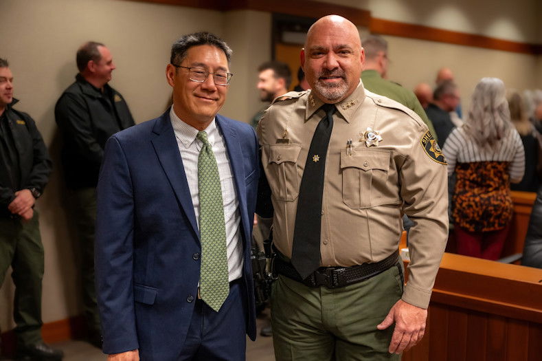 Re-elected Deschutes County Commissioner Phil Chang and new Sheriff Kent van der Kamp posed after they were sworn into office on Monday.