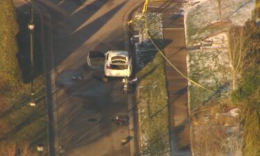 The Raleigh Police Department's bomb squad investigators used a robot to inspect the suspect's car left at the scene of a shooting that left the shooter and another man dead and injured a police officer.