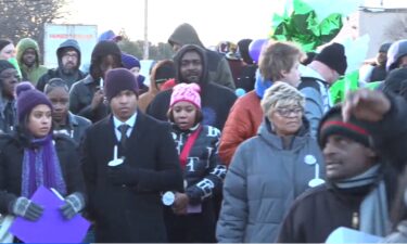 Vigil held for Ashley Elkins as family and friends continue searching for her.