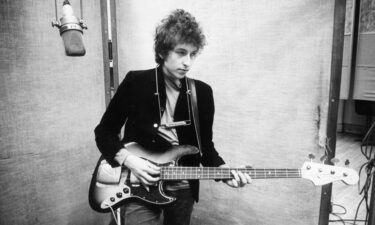 Bob Dylan plays a Fender Jazz bass while recording his album "Bringing It All Back Home" in January 1965 in Columbia's Studio A in New York City.