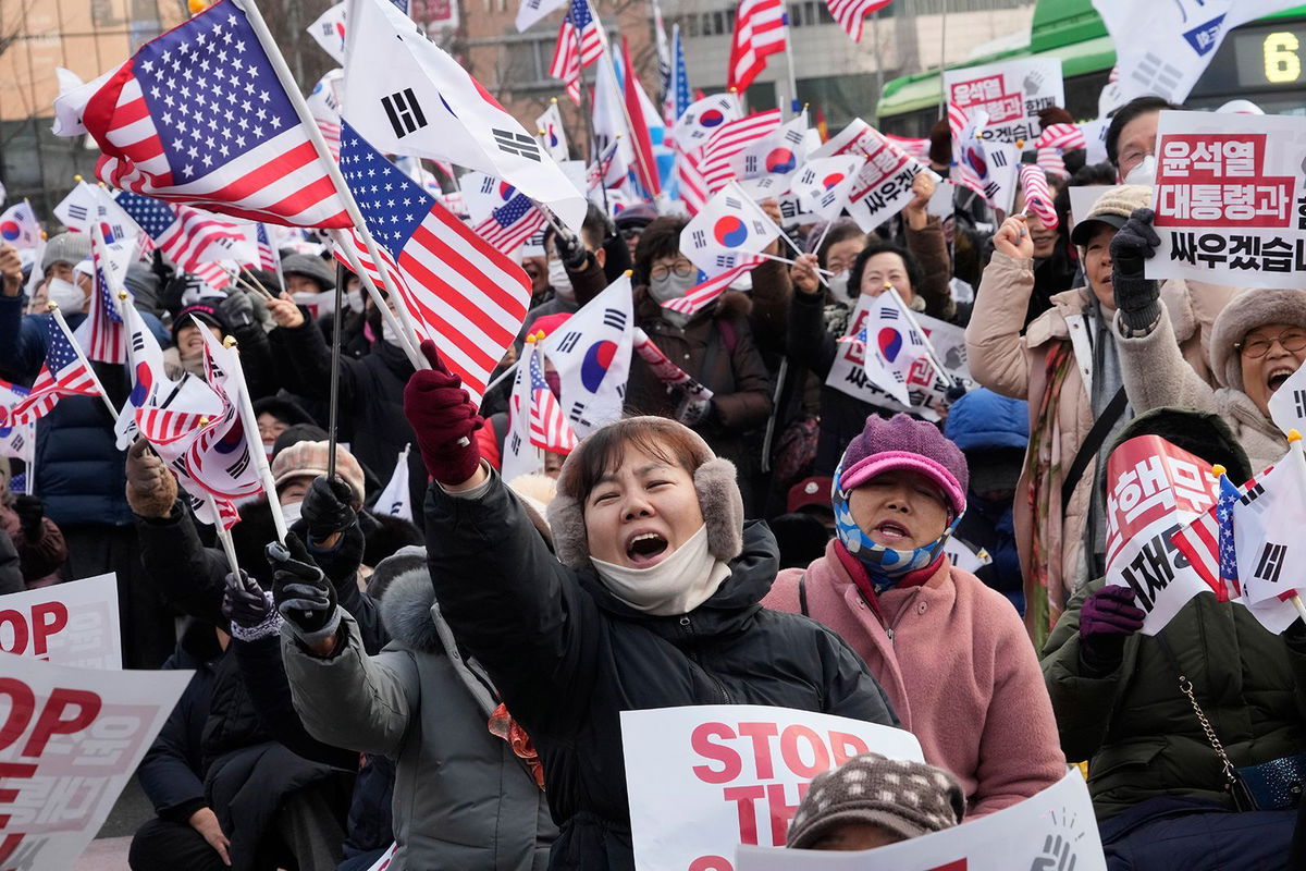 <i>Ahn Young-joon/AP via CNN Newsource</i><br/>Supporters of impeached South Korean President Yoon Suk Yeol shout slogans during a rally to oppose his impeachment near the presidential residence in Seoul