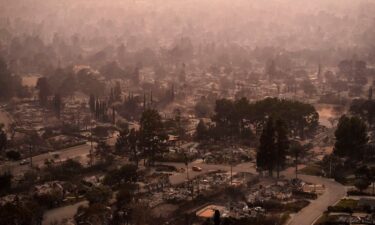 Smoke lingers over a neighborhood devastated by the Eaton Fire