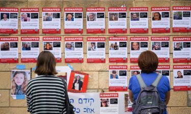 Photographs of some hostages taken by Hamas are seen here in Tel Aviv