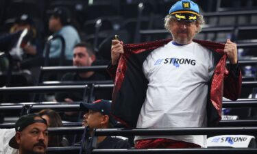 A Los Angeles Clippers fan poses in an "LA Strong" shirt before the team's game against the Miami Heat.