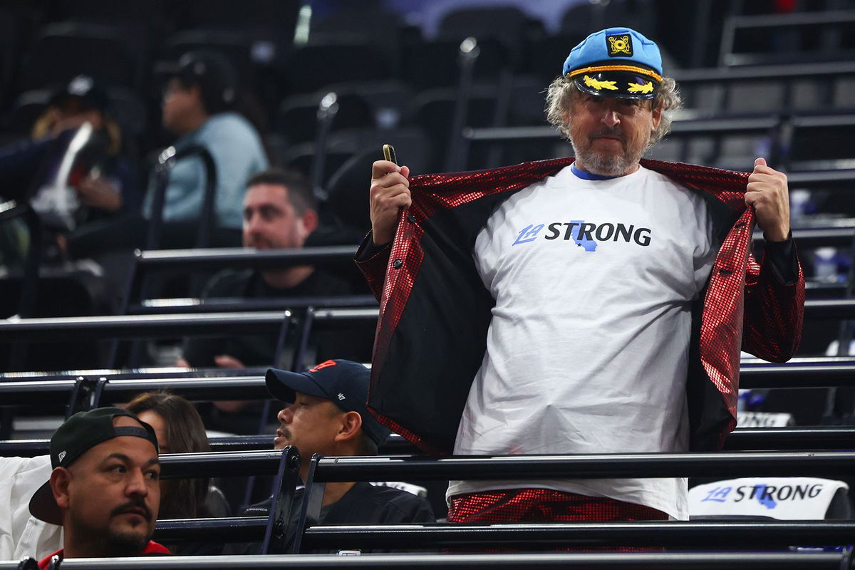 <i>Jessie Alcheh/AP via CNN Newsource</i><br/>A Los Angeles Clippers fan poses in an 