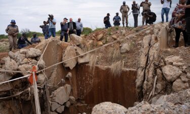 South African government officials inspect the abandoned Stilfontein mine