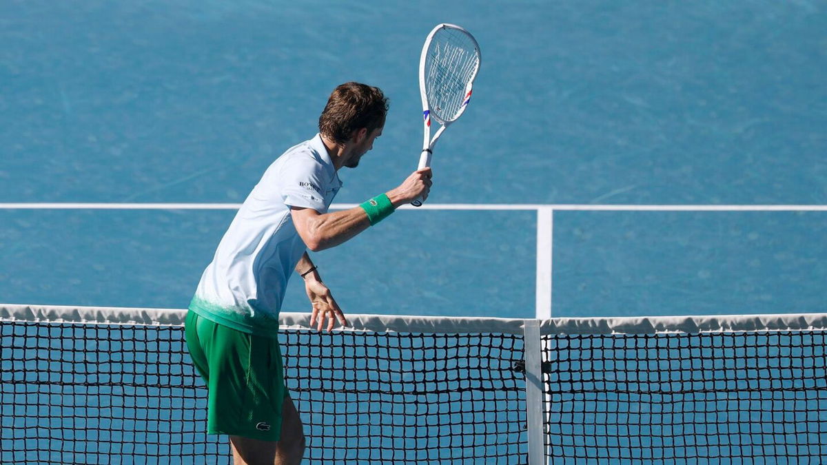 <i>Daniel Pockett/Getty Images via CNN Newsource</i><br/>Daniil Medvedev takes aim at a small camera attached to the net after growing frustrated.