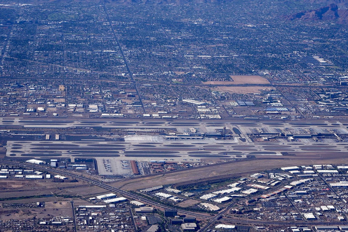 <i>Image of Sport/LEEKI/AP via CNN Newsource</i><br/>An aerial view of Phoenix Sky Harbor International Airport is pictured in 2021. The Federal Aviation Administration is investigating a narrowly missed midair collision between a United flight and a Delta flight at Phoenix Sky Harbor International Airport on January 11