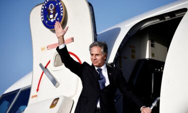 Secretary of State Antony Blinken waves as he departs from Rome Ciampino Airport on January 10.