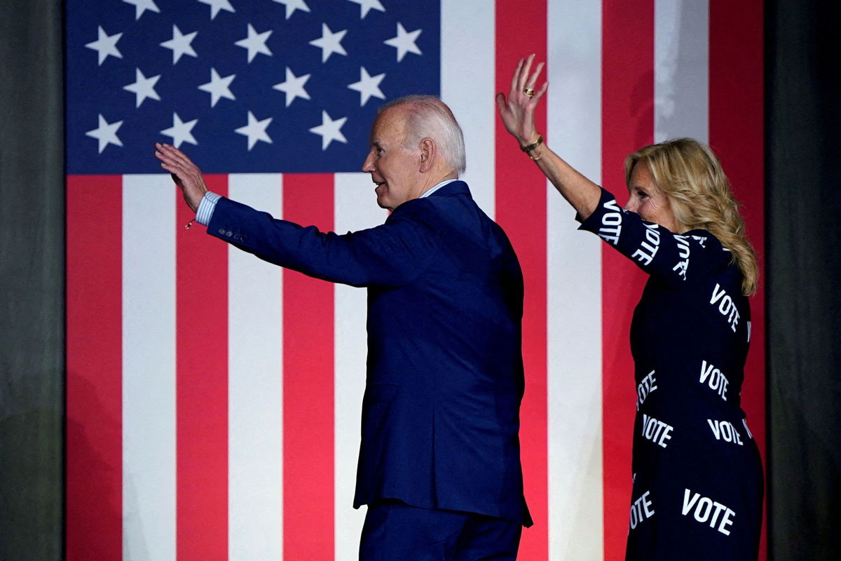 <i>Elizabeth Frantz/Reuters via CNN Newsource</i><br/>President Joe Biden and first lady Jill Biden wave during a campaign rally in Raleigh