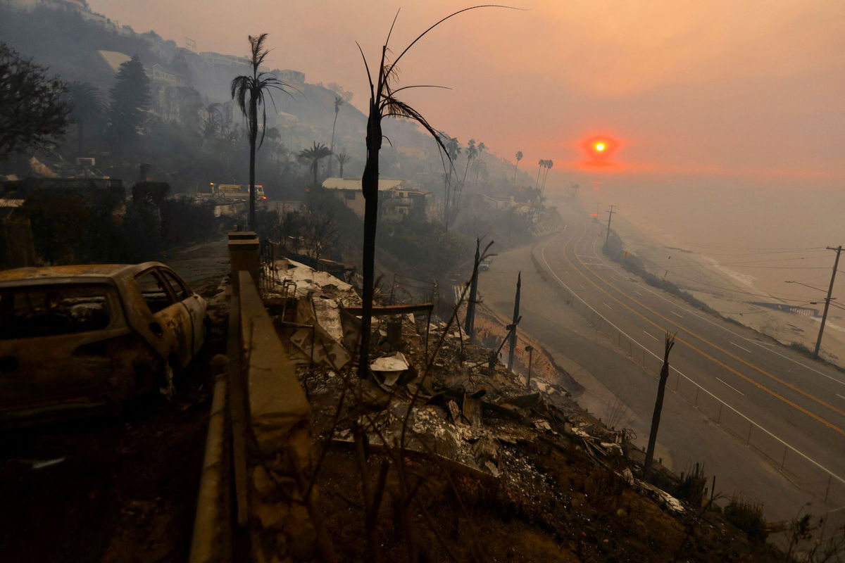 <i>Maria Alejandra Cardona/Reuters via CNN Newsource</i><br/>Sun rises over the Pacific Palisades neighborhood of Los Angeles on January 9. Prominent media personalities are calling on the federal government to withhold or place conditions on aid for victims of the Los Angeles wildfires.