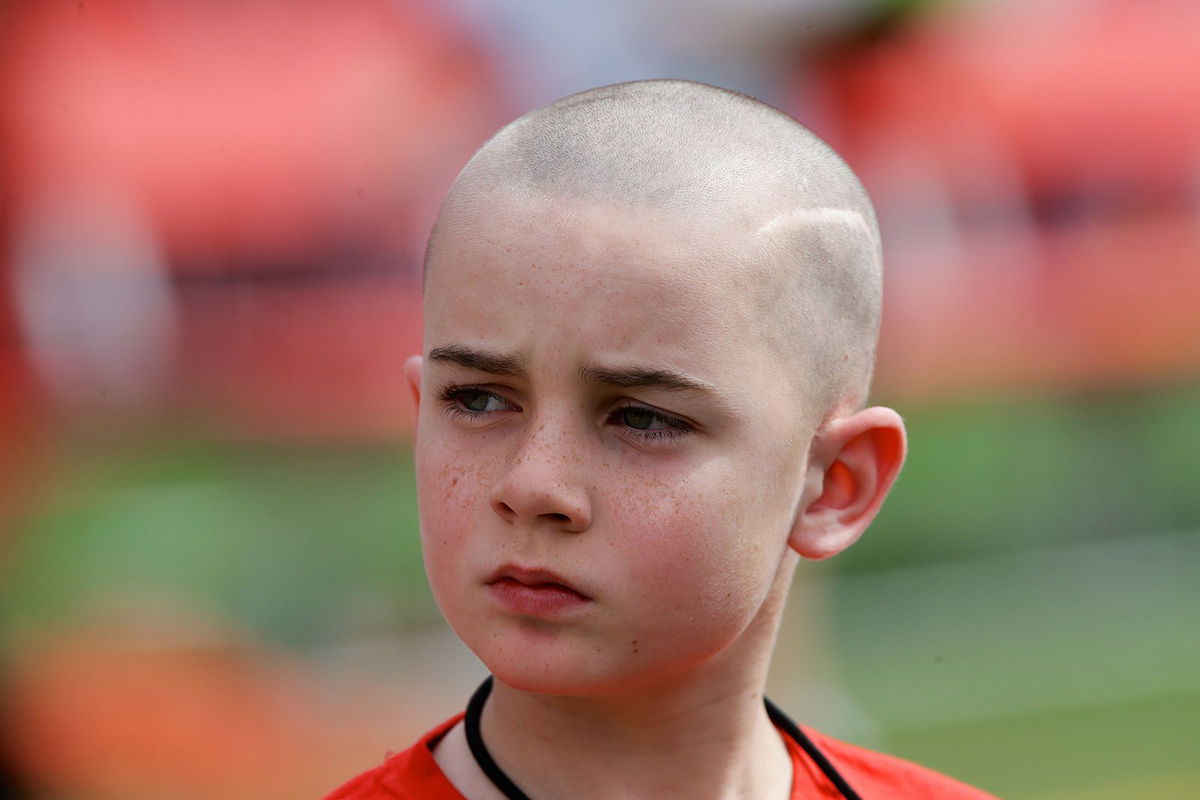 <i>Nati Harnik/AP via CNN Newsource</i><br/>Cancer survivor Jack Hoffman is seen here before delivering a drug-free pledge during halftime of the University of Nebraska spring game in 2014. Hoffman has died of brain cancer at the age of 19.