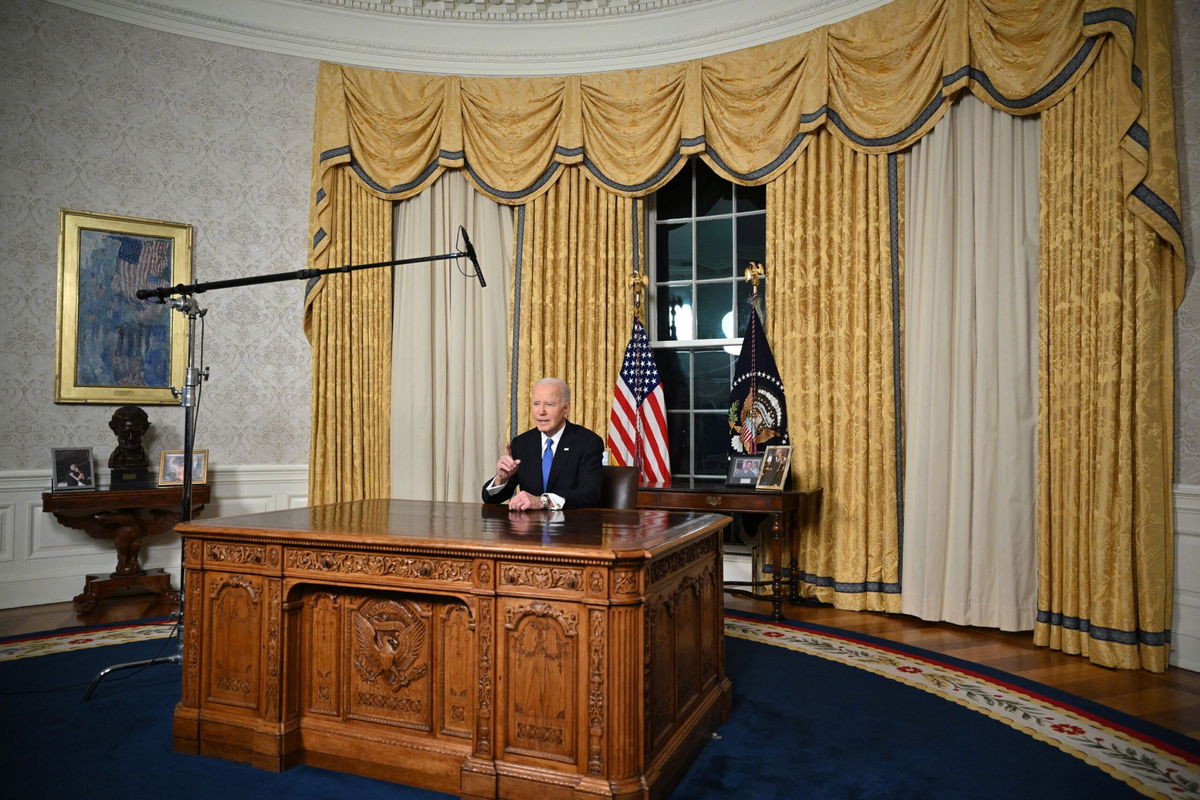 <i>Mandel Ngan/AFP/Getty Images via CNN Newsource</i><br/>US President Joe Biden delivers his farewell address to the nation from the Oval Office of the White House in Washington.