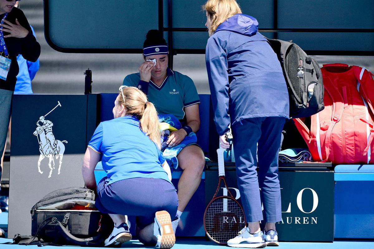 <i>Yuichi Yamazaki/AFP/Getty Images via CNN Newsource</i><br/>Jabeur receives medical attention in her second-round match at the Australian Open.