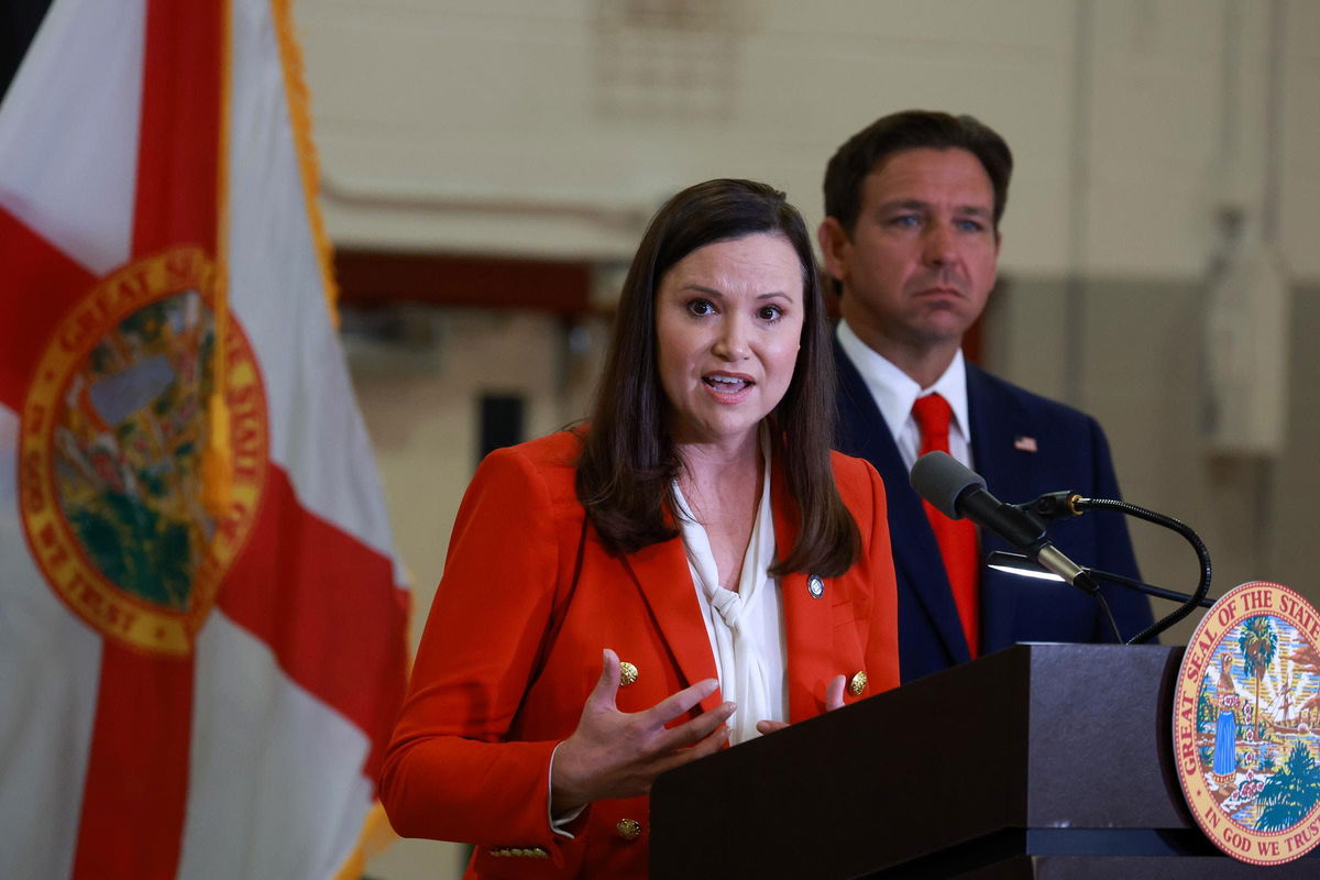 <i>Joe Raedle/Getty Images/File via CNN Newsource</i><br/>Florida Gov. Ron DeSantis listens as Florida Attorney General Ashley Moody speaks during a press conference regarding an apparent assassination attempt of former President Donald Trump on September 17