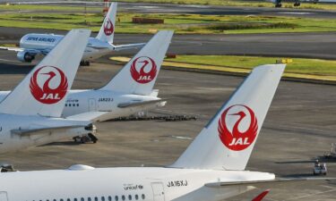 This photo taken on October 2022 shows passenger planes for Japan Airlines (JAL) on the tarmac as another (R) lands at Tokyo International Airport at Haneda in Tokyo.