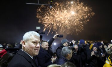 Romanian minister of Internal Affairs Catalin Predoiu amid fireworks as Romania and Bulgaria join the EU's Schengen area.