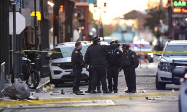 Emergency services attend the scene on Bourbon Street after a vehicle drove into a crowd on New Orleans' Canal and Bourbon Street on January 1.