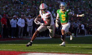 Ohio State wide receiver Jeremiah Smith scores a touchdown against Oregon.