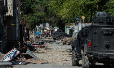 Police patrol around Bernard Mevs hospital where armed gangs have spread violence in Port-au-Prince on December 17