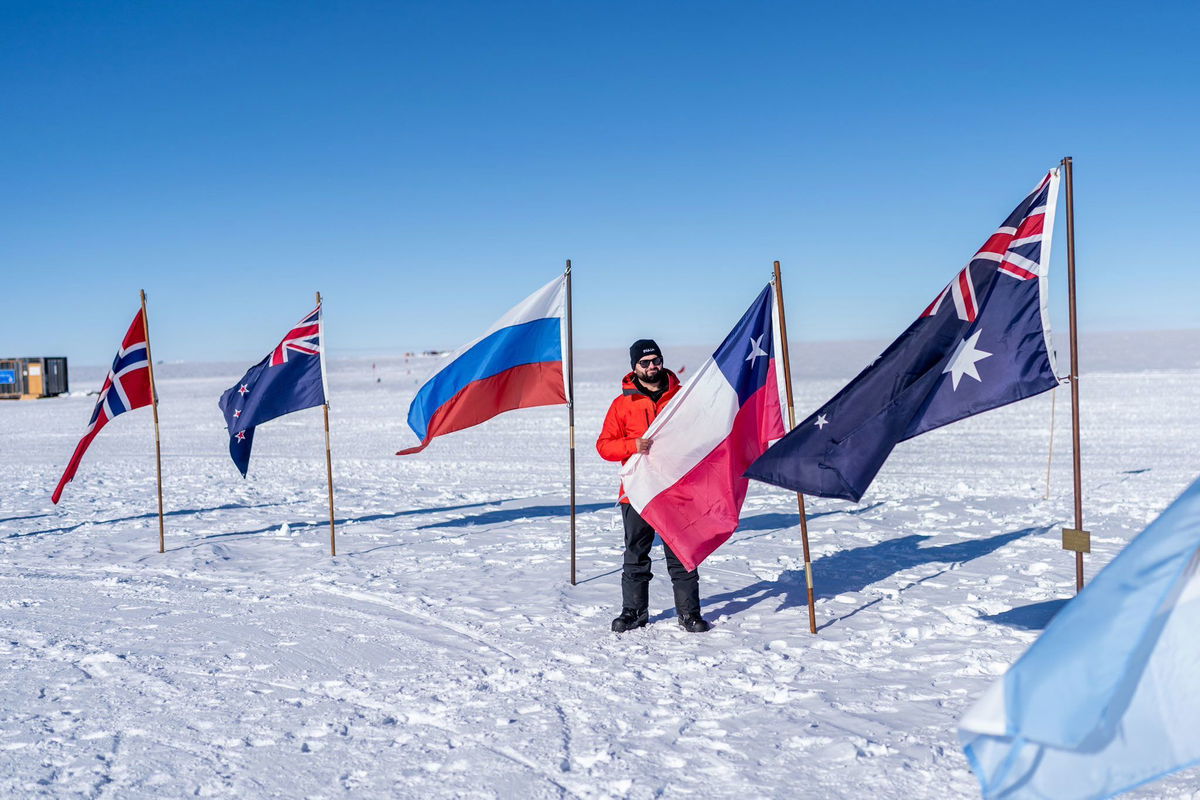 <i>Gabriel Boric Font/X via CNN Newsource</i><br/>Chile’s President Gabriel Boric displays his country's flag at the South Pole on Friday