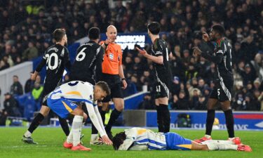 Brighton's Brazilian striker João Pedro reacts following the foul as referee Anthony Taylor gives a penalty to Brighton.