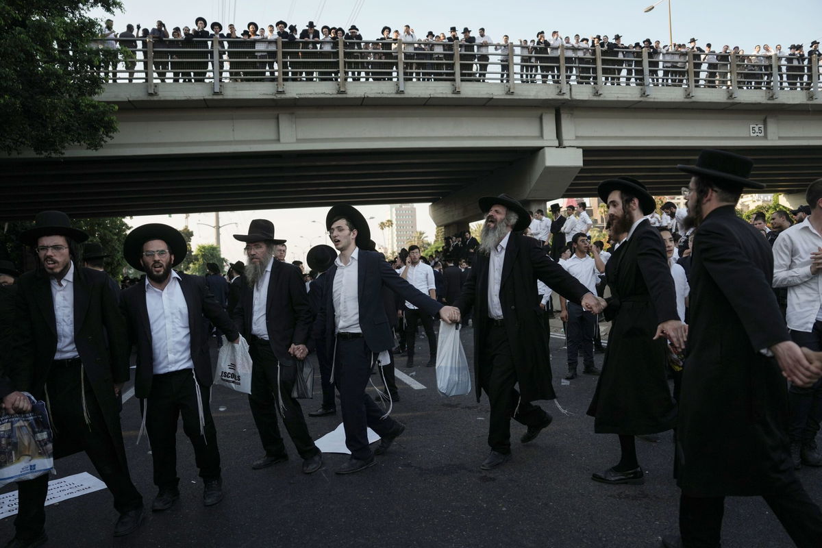 <i>Oded Balilty/AP/File via CNN Newsource</i><br/>Ultra-Orthodox Jewish men block a highway during a protest against army recruitment in Bnei Brak