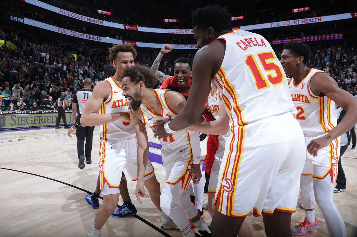 <i>Melissa Majchrzak/NBAE/Getty Images via CNN Newsource</i><br/>Young was mobbed by his teammates after his stunning effort.