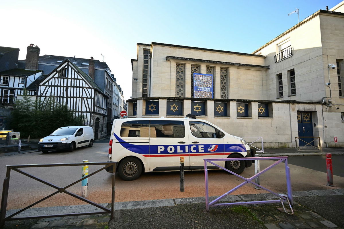 <i>Lou Benoist/AFP/Getty Images via CNN Newsource</i><br/>A police car outside a synagogue in Rouen