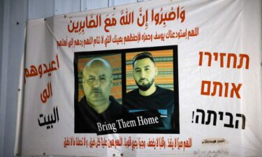 A banner bearing pictures of  Yousef Al-Ziyadnah and his son Hamza in the city of Rahat.