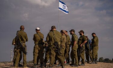 Israeli soldiers on a hill close to the Gaza border in southern Israel