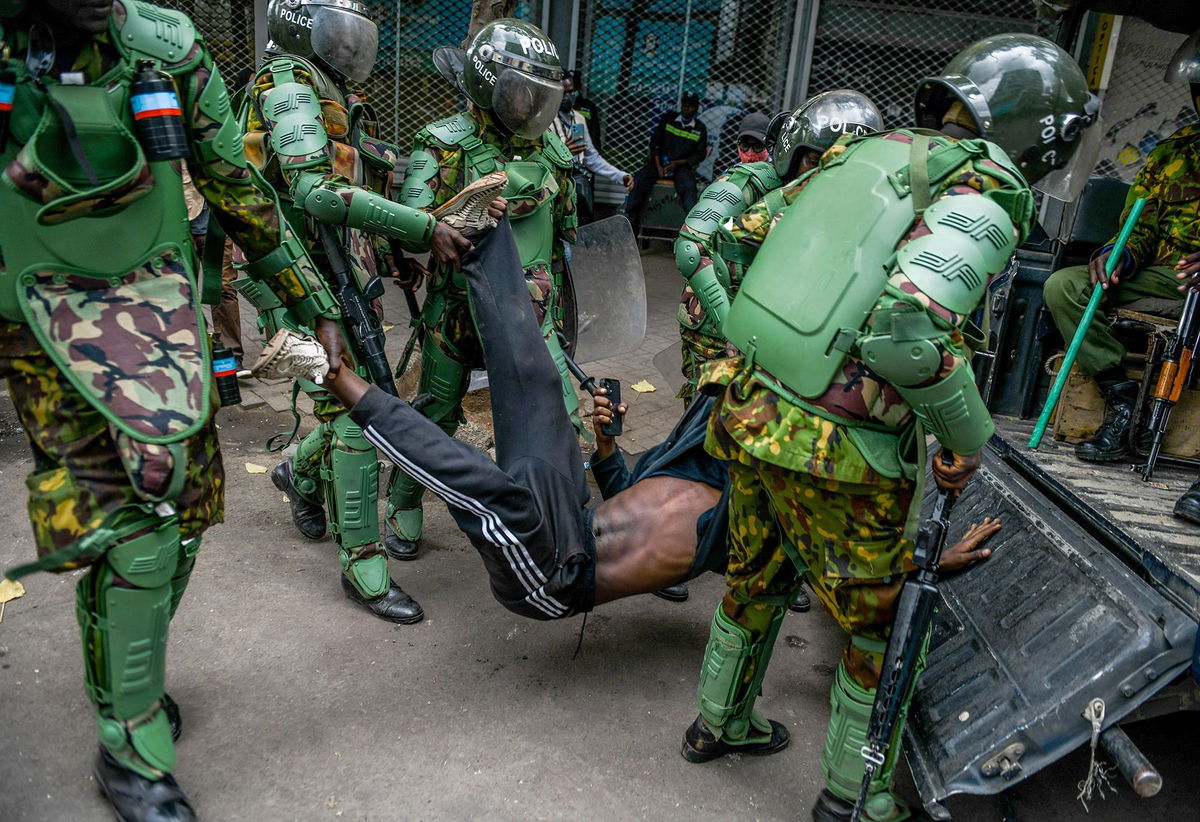 <i>Gerald Anderson/Anadolu/Getty Images via CNN Newsource</i><br/>Kenyan police officers intervene during June's protests against controversial tax plans.