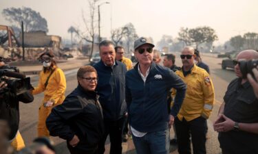 California Gov. Gavin Newsom and Los Angeles Mayor Karen Bass tour the downtown business district of Pacific Palisades as the Palisades Fire continues to burn on January 8 in Los Angeles