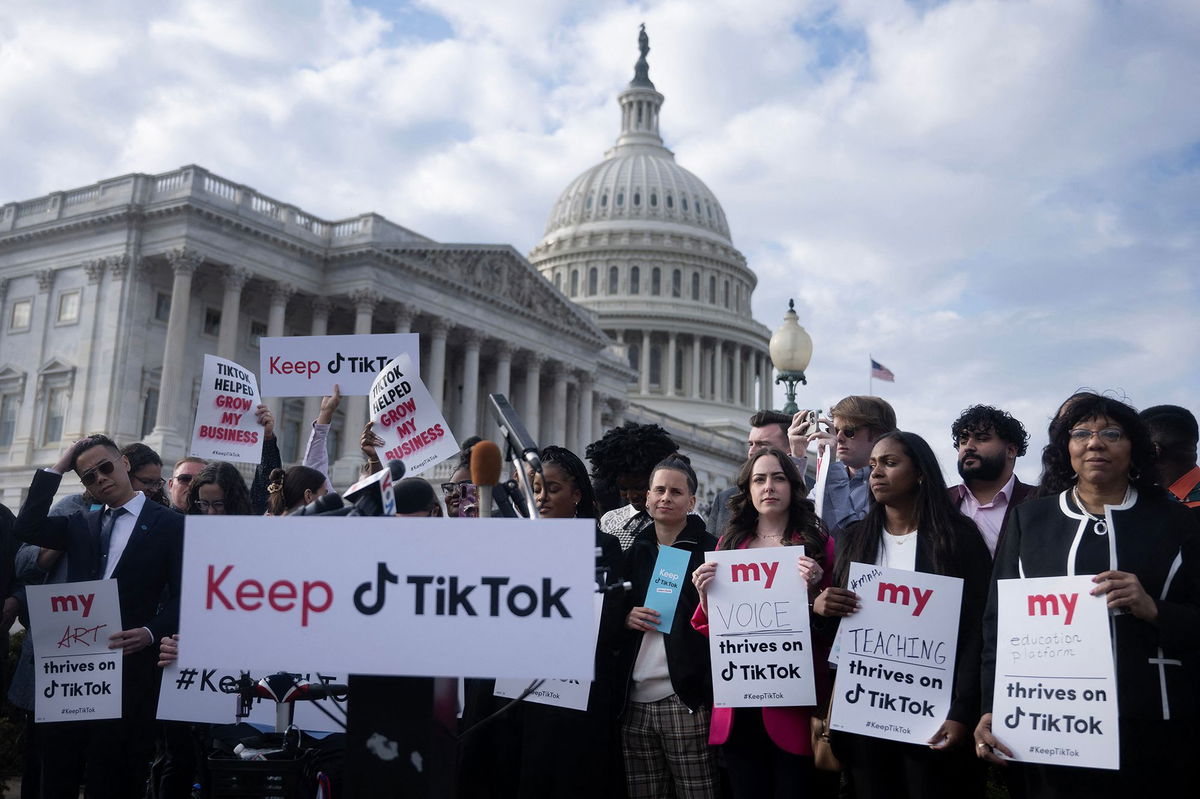 <i>Brendan Smialowski/AFP/Getty Images via CNN Newsource</i><br/>People gather for a press conference about their opposition to a potential TikTok ban on Capitol Hill in Washington