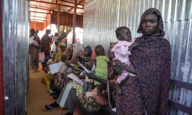 A woman and baby are seen at the Zamzam displacement camp