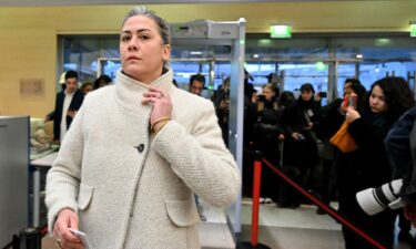 Caroline Darian passes through security check as she arrives at the courthouse in Avignon