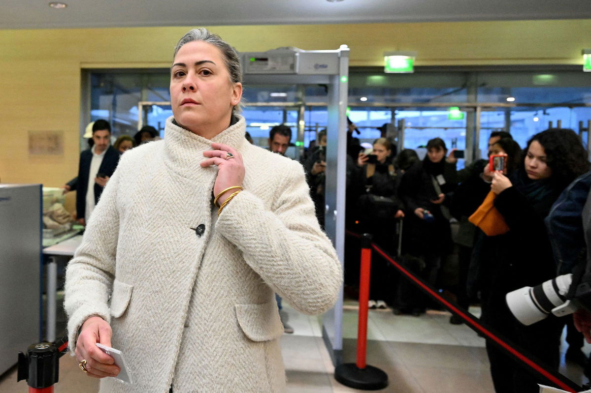 <i>Miguel Medina/AFP/Getty Images/File via CNN Newsource</i><br/>Caroline Darian passes through security check as she arrives at the courthouse in Avignon