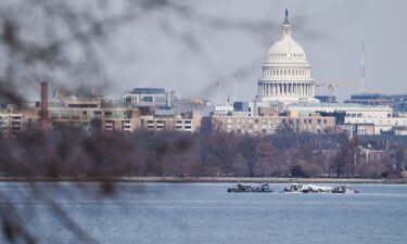Search and rescue teams work in the aftermath of the collision of American Eagle flight 5342 and a Black Hawk helicopter that crashed into the Potomac River