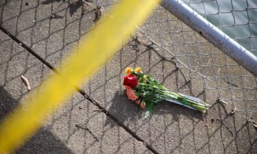 A bouquet of flowers sits on the banks of the Potomac River in Washington