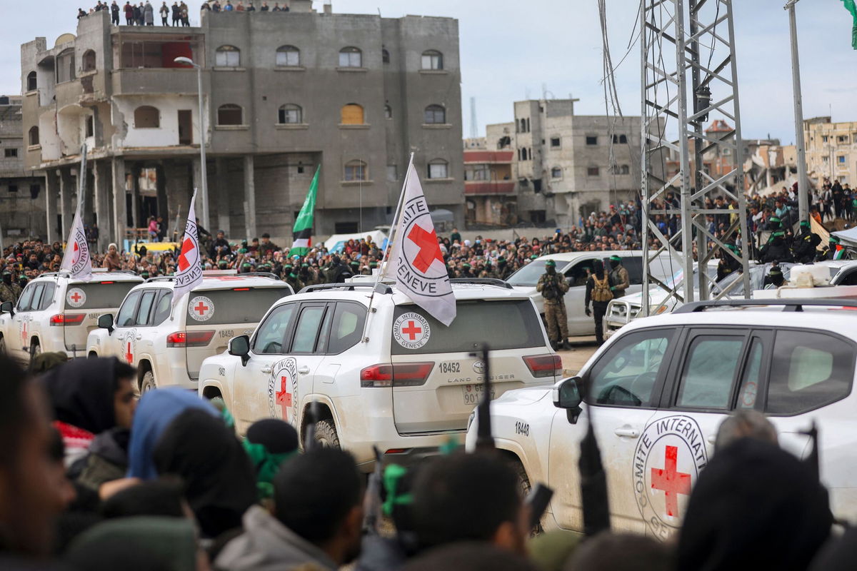 <i>Youssef Alzanoun/Middle East Images/AFP/Getty Images via CNN Newsource</i><br/>International Red Cross vehicles arrive at the site of the handing over of two Israeli hostages in Rafah in the southern Gaza Strip