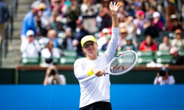 Iga Świątek celebrates defeating Karolína Muchová in the fourth round of the BNP Paribas Open at Indian Wells on March 11.