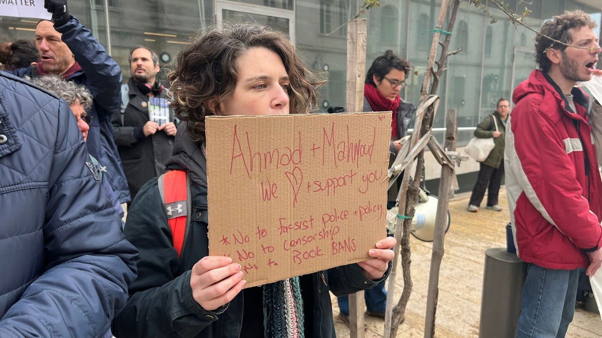 <i>Kareem Khadder/CNN via CNN Newsource</i><br/>Protesters holding signs in front of a courthouse after the Educational Bookshop was raided by Israeli police and its owners arrested.