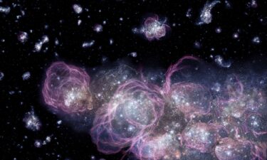 An artist's concept illustrates how the universe might have looked when it was less than 1 billion years old. Star formation voraciously consumed primordial hydrogen