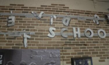 A mural depicting the damaged sign at Belvidere High School after the tornado on April 21