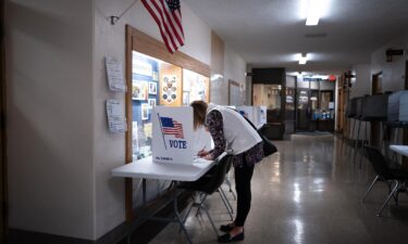 A resident participates in in-person early voting at the Municipal Building on March 26 in Kenosha