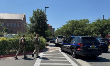 Law enforcement vehicles are stationed outside of Florida State University’s student union building after a shooting on the university campus on Thursday.