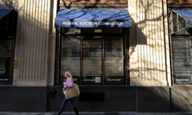 A pedestrian walks past the Federal Election Commission's headquarters in October 2016